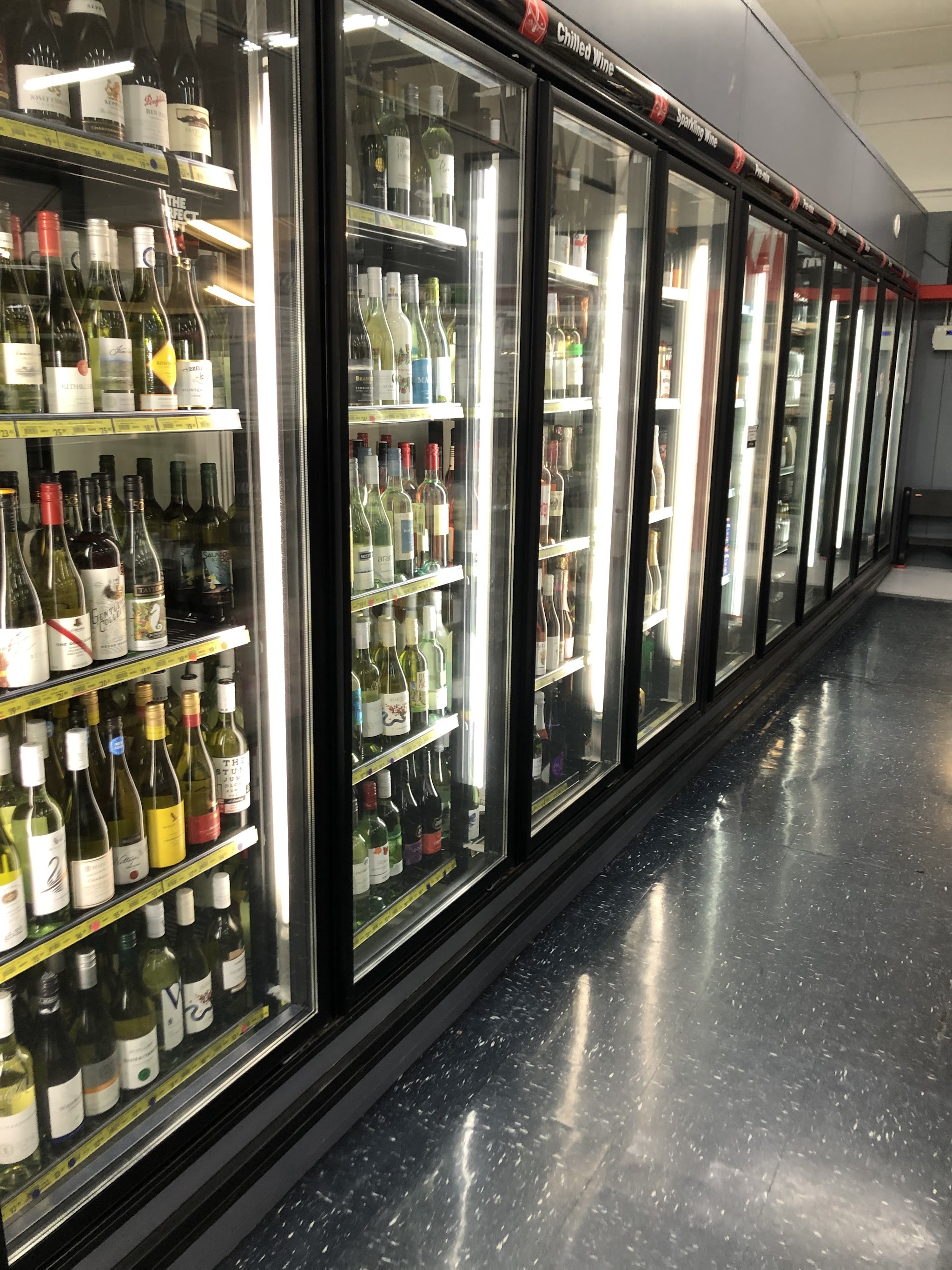 A long run of glass door upright display fridges labelled Chilled Wine and Sparkling Wine, serviced by MixAir